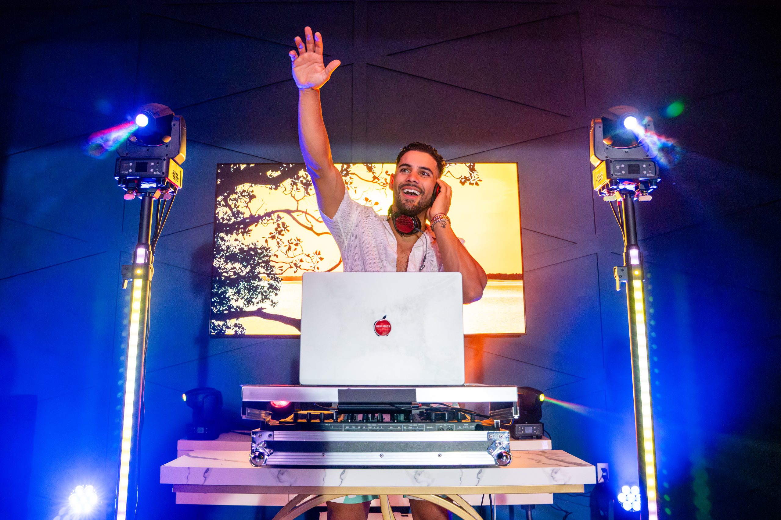 in situ shot front view of DJ using two Chauvet DJ Sentinel series Q60ILS moving spot lights on left and right totems